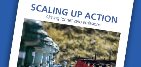 A close up of the Scaling Up Action document on a dark blue background.