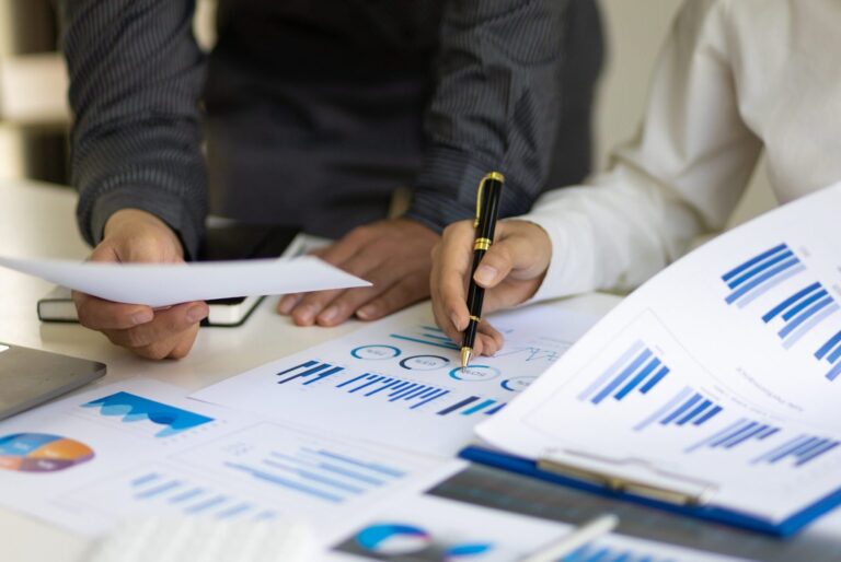 Two people sharing report findings