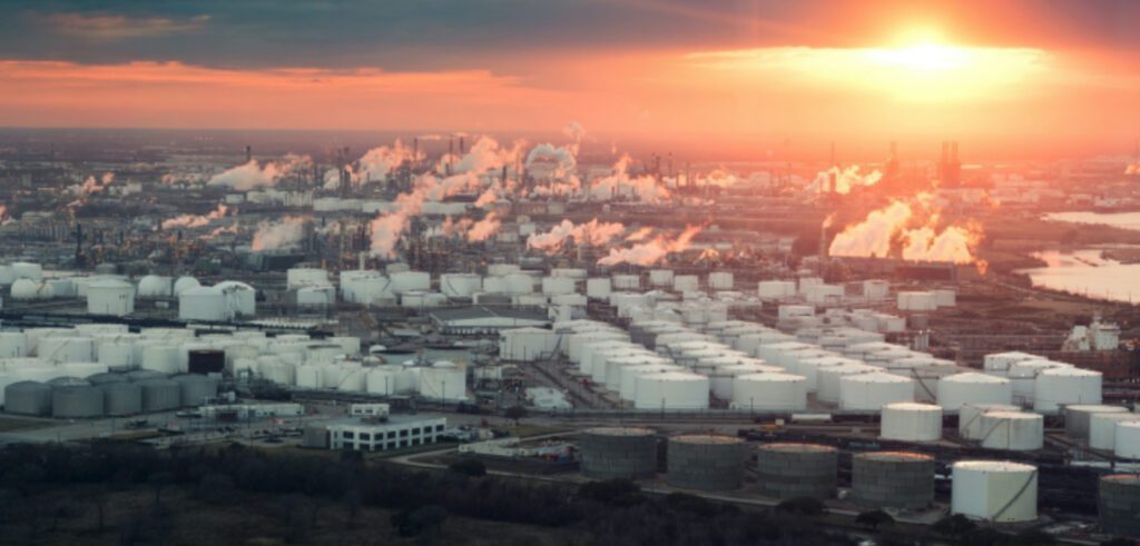 A view from above over an oil field a sunset.