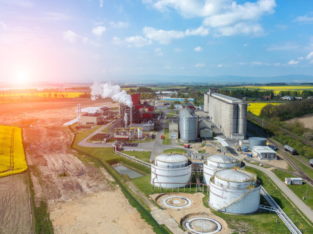 A beautiful sunset over a biomass factory.