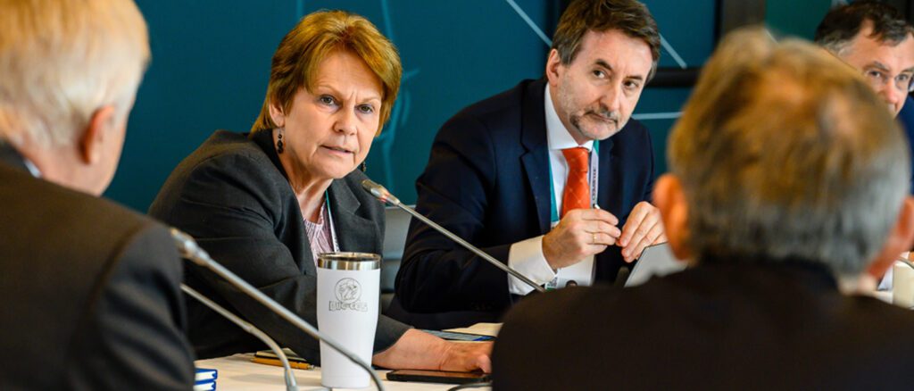 Vicki Hollub, CEO of Occidental, and Josu Jon Imaz, CEO of Repsol S.A., pictured facing the camera during a meeting.