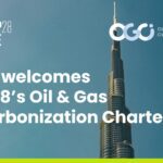 The title of the article, "OGCI welcomes COP28's Oil & Gas Decarbonization Charter", overlaid on a picture of a skyscraper protruding into the sky. The COP28 UAE logo is to the top left and the OGCI logo is in the top right.